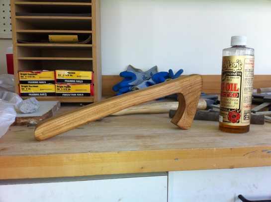 Oiling up the handle in the wood shop.